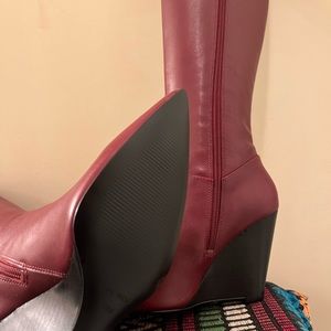 Never worn leather wedge heel boot